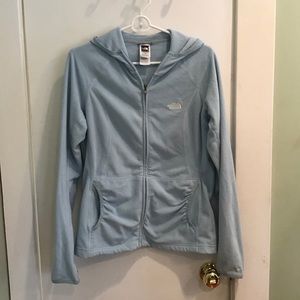 A light blue, The North Face zip up.